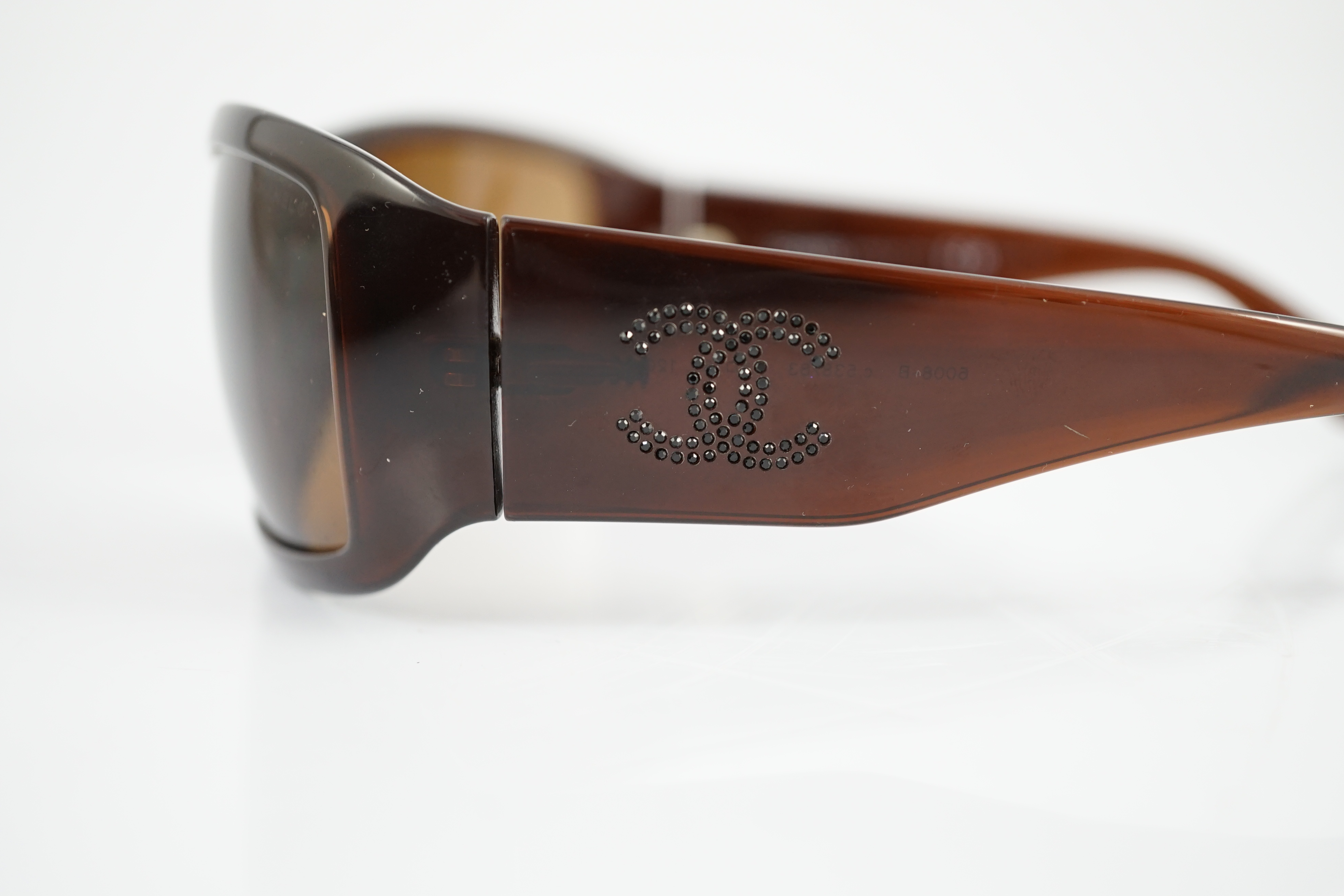 A pair of Chanel brown sunglasses